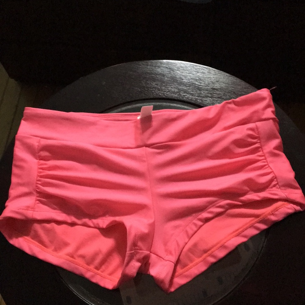 Pink bikini bottoms with cinch detailing